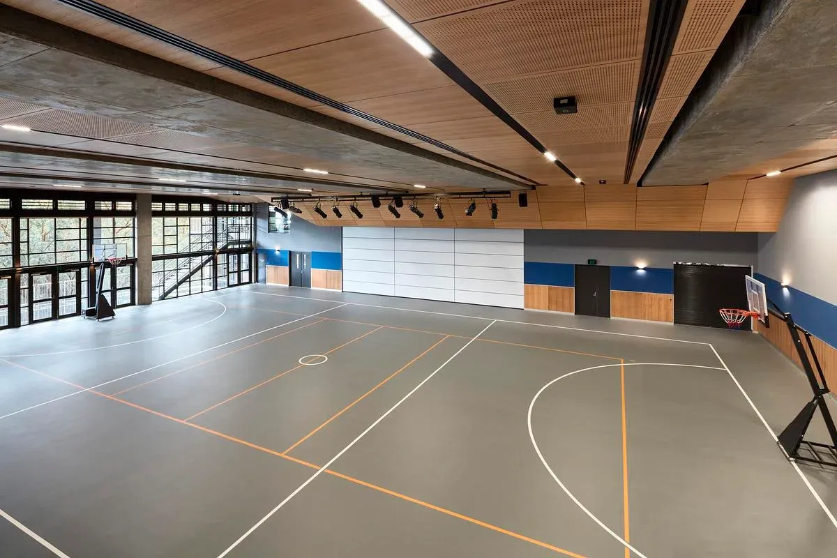 The basketball court in Donvale Christian College's Community Hub, under a timber ceiling