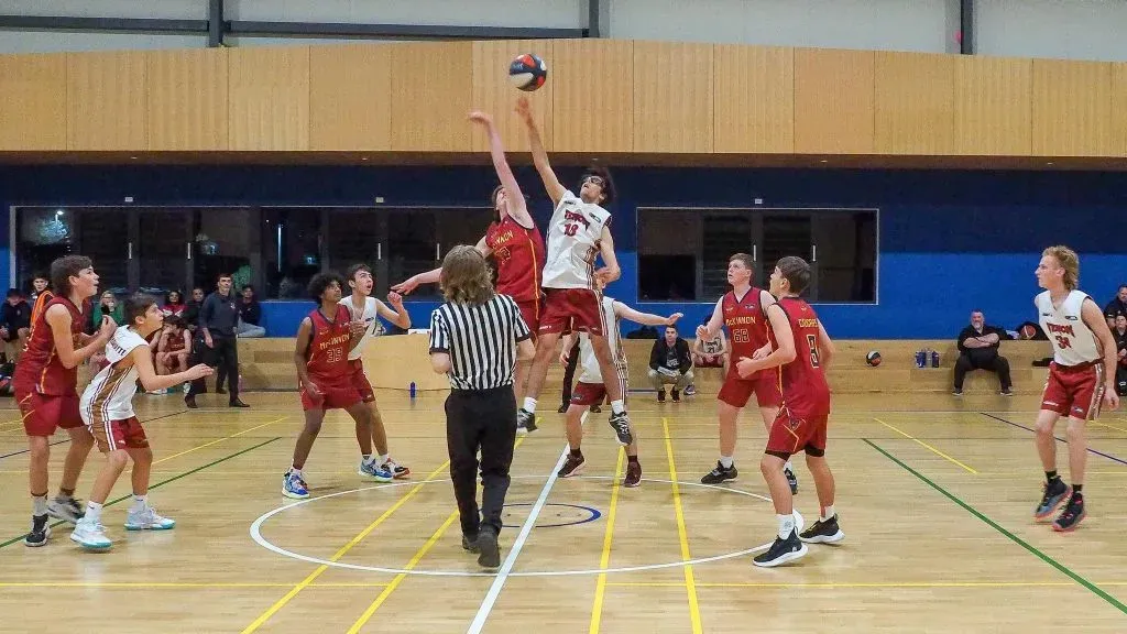 Venom junior girls at the tip-off of a VJBL game